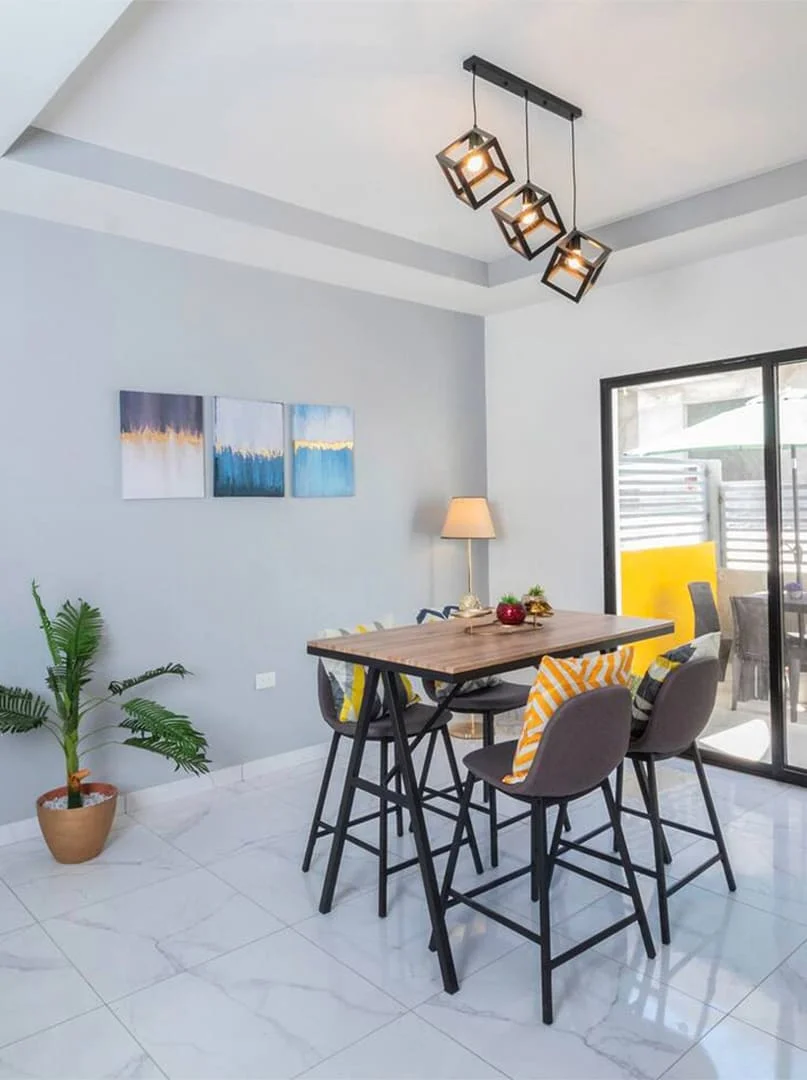 modern dining room with yellow armchairs