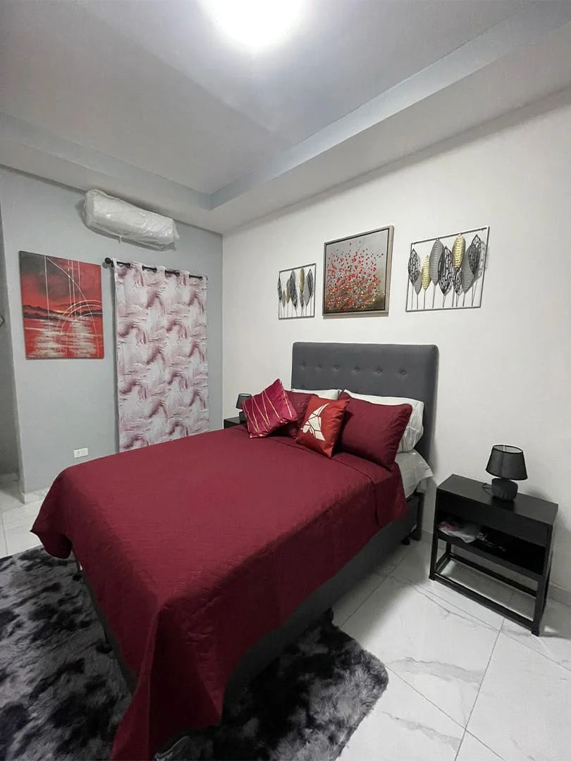 Bedroom, large bed with backrest and white furniture